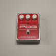 Load image into Gallery viewer, Electro-Harmonix Micro POG Polyphonic Octave Generator guitar pedal with a red faceplate, silver metal casing, three white knobs, and a central silver footswitch on a neutral gray background.
